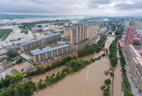 More people go missing and thousands are evacuated as northeast China is hit by more floods